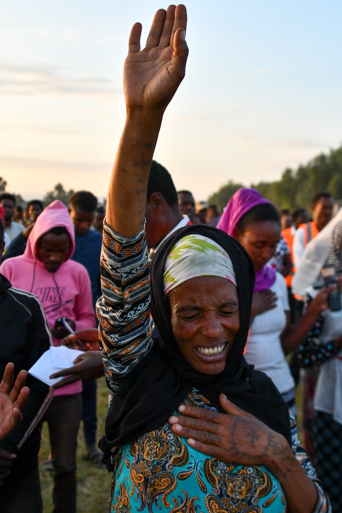 Believers responding in prayer at an outreach