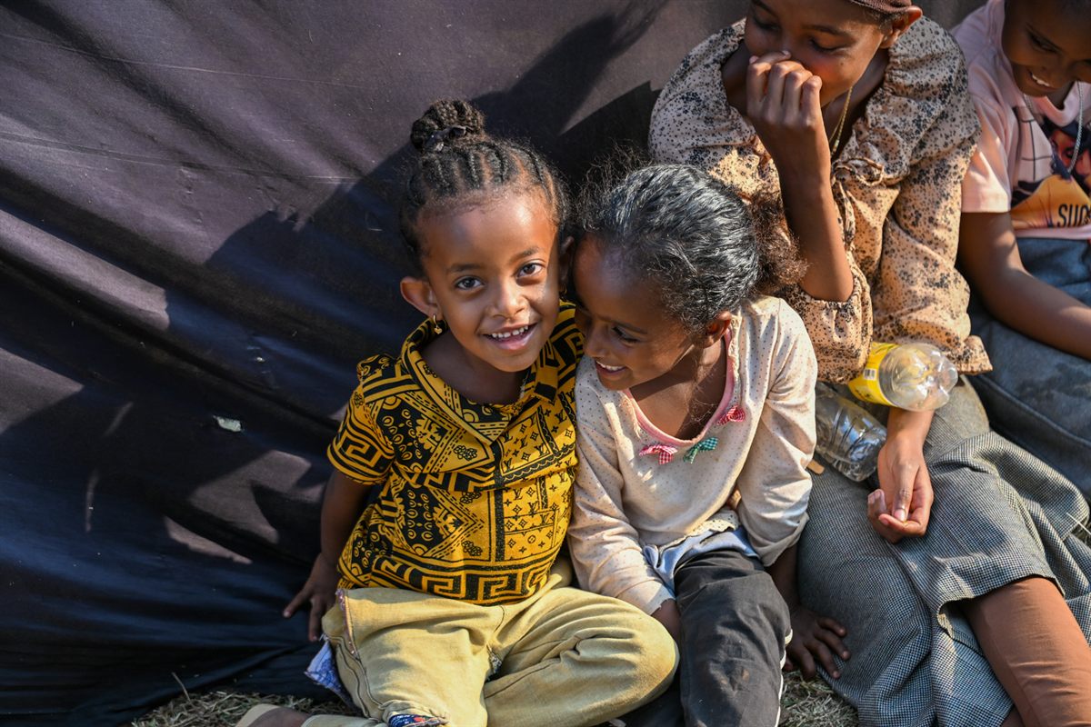 Children smiling during the outreach