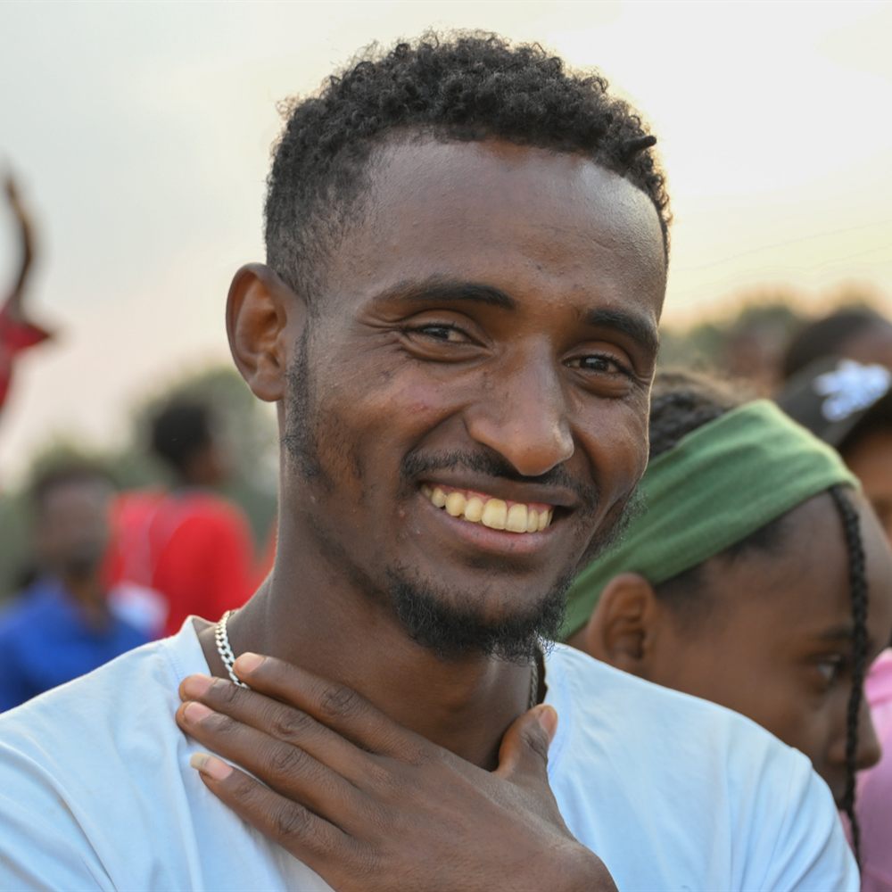 Smiling man in the crowd
