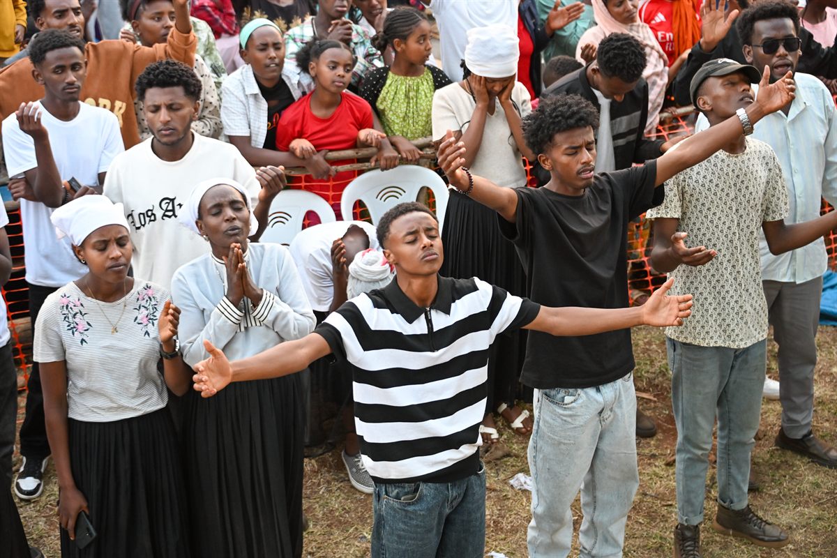 People praying at the front of the crusade