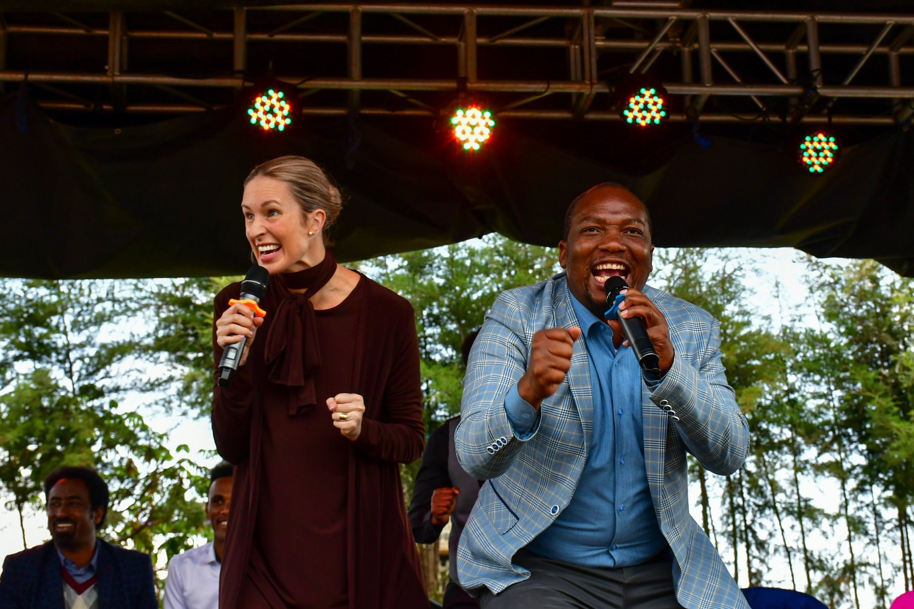 Invitation event hosts on stage