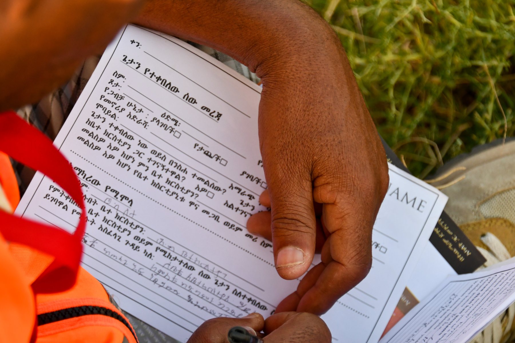 Participant completing a ministry follow-up card